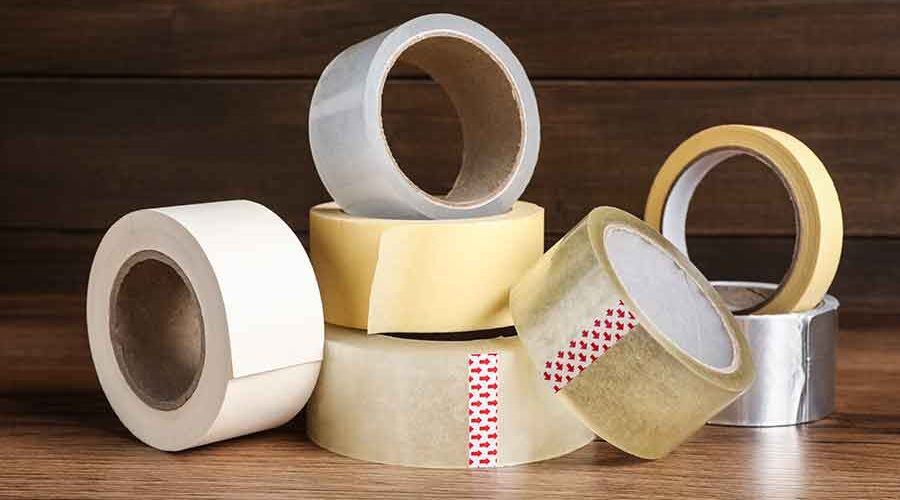 Consumable-Pack-Tapes-rolls-of-adhesive-tape-on-wooden-table